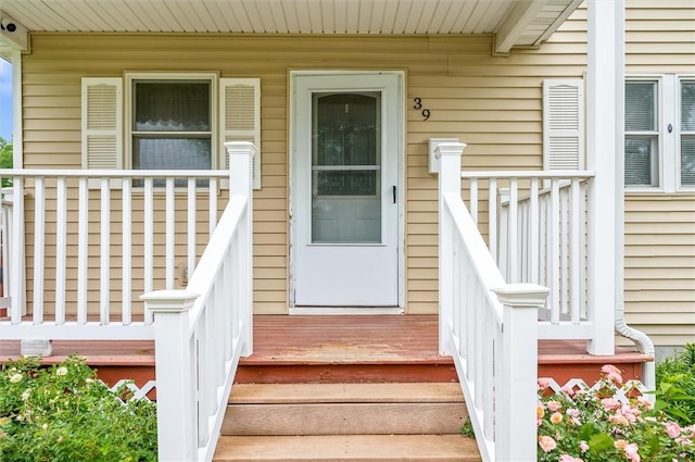 39 Castleford Rd, Greece, NY 14616 - doorway to property featuring covered porch