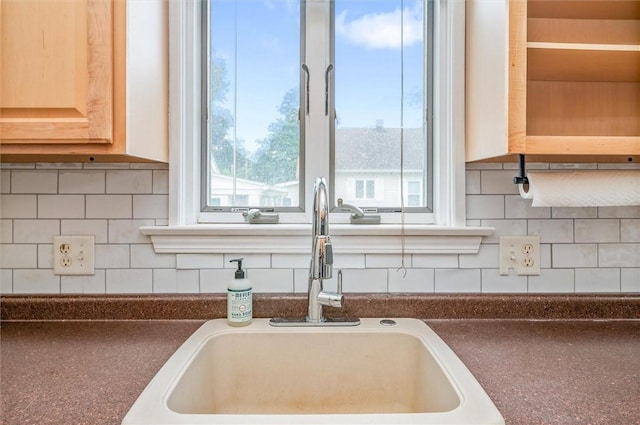 39 Castleford Rd, Greece, NY 14616 - kitchen featuring tasteful backsplash, dark countertops, and plenty of natural light
