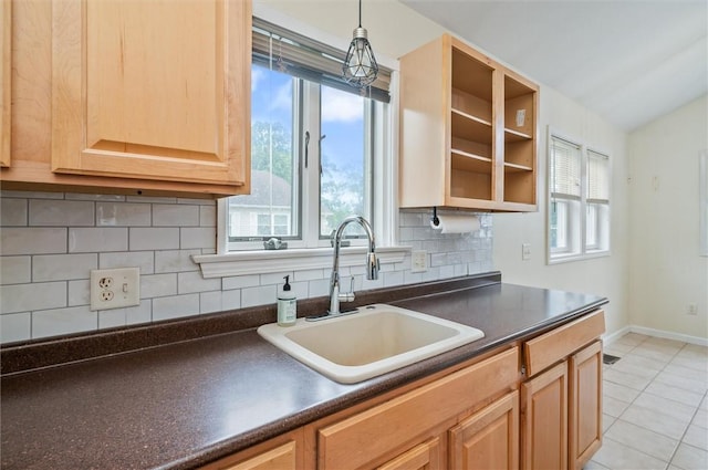 39 Castleford Rd, Greece, NY 14616 - kitchen featuring dark countertops, light tile patterned floors, tasteful backsplash, light brown cabinets, and hanging light fixtures