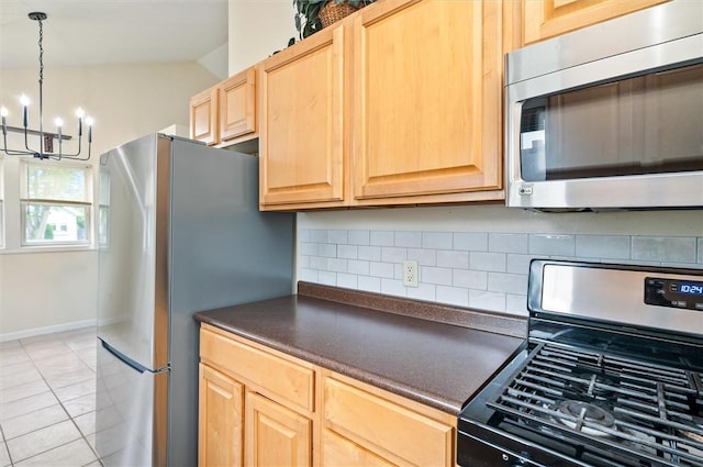 39 Castleford Rd, Greece, NY 14616 - kitchen with appliances with stainless steel finishes, light brown cabinets, dark countertops, a chandelier, and lofted ceiling