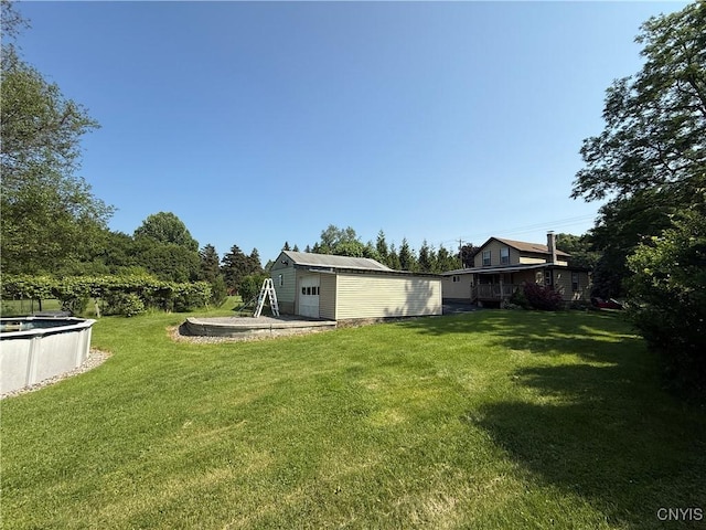 5130 Onondaga Rd, Onondaga, NY 13215 - view of green lawn featuring an outbuilding and an outdoor pool
