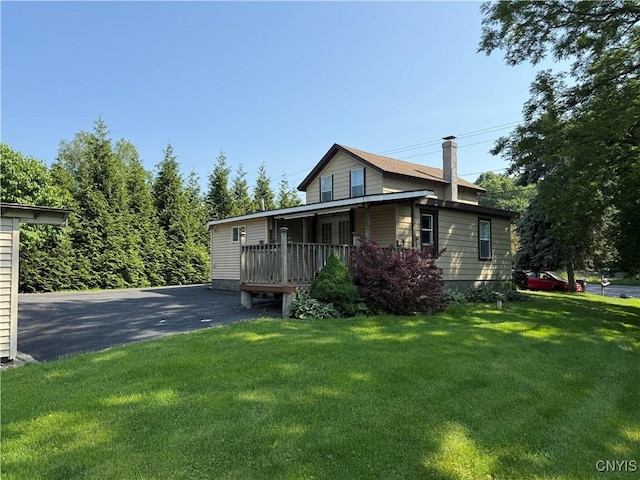 5130 Onondaga Rd, Onondaga, NY 13215 - view of front of property featuring a front lawn and asphalt driveway