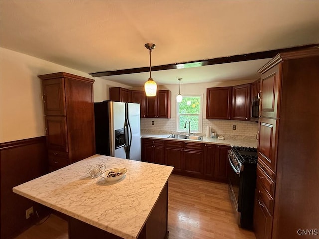 5130 Onondaga Rd, Onondaga, NY 13215 - kitchen with appliances with stainless steel finishes, light countertops, light wood-style flooring, and backsplash