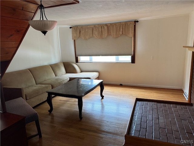5130 Onondaga Rd, Onondaga, NY 13215 - living area featuring baseboards and wood finished floors