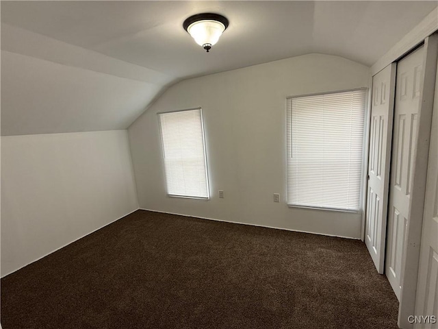 5130 Onondaga Rd, Onondaga, NY 13215 - additional living space featuring vaulted ceiling and dark colored carpet