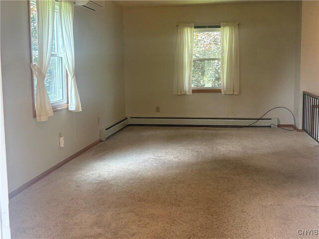 36 Lee Rd, Dryden, NY 13053 - empty room with plenty of natural light, carpet, a baseboard radiator, and a wall unit AC