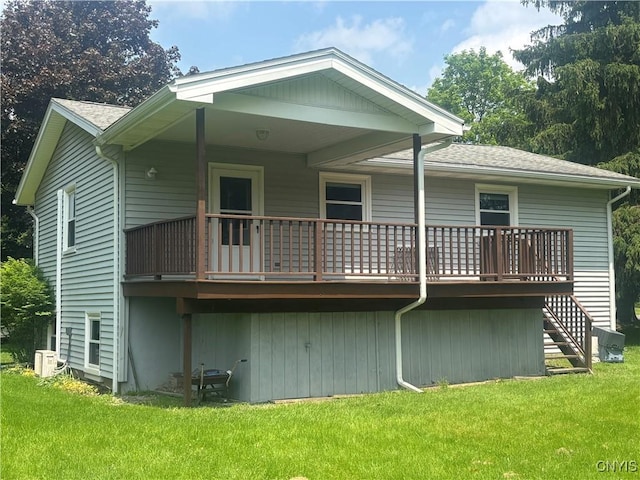 36 Lee Rd, Dryden, NY 13053 - back of property with a yard, a deck, stairway, and roof with shingles