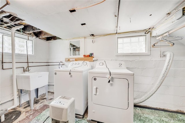 315 Westfield Rd N, Amherst, NY 14226 - washroom with washer and dryer, healthy amount of natural light, and concrete block wall
