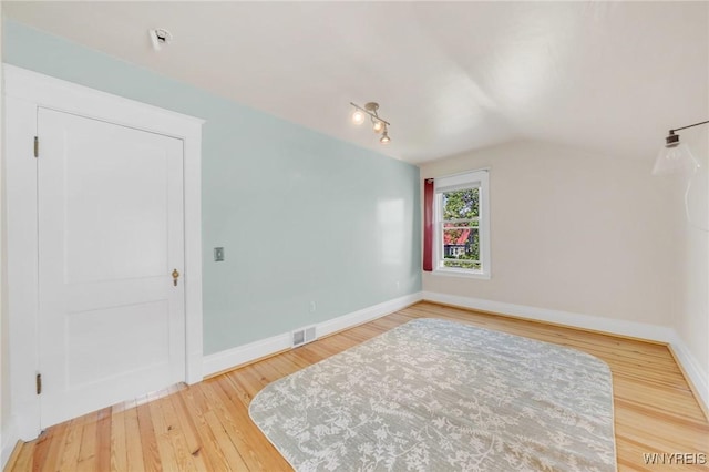 315 Westfield Rd N, Amherst, NY 14226 - additional living space featuring wood finished floors and vaulted ceiling