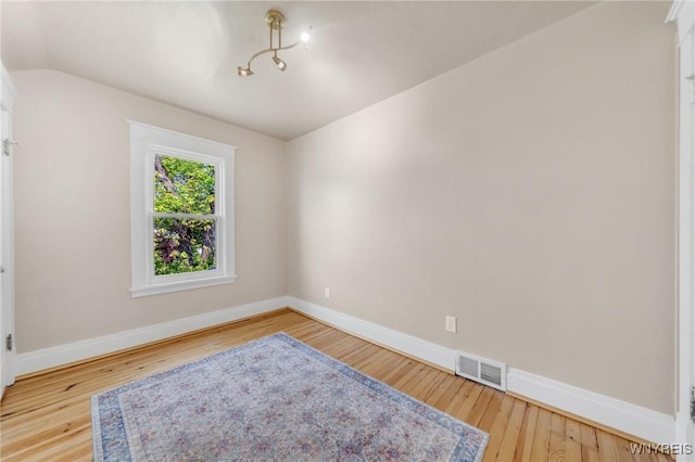 315 Westfield Rd N, Amherst, NY 14226 - spare room featuring lofted ceiling and wood finished floors