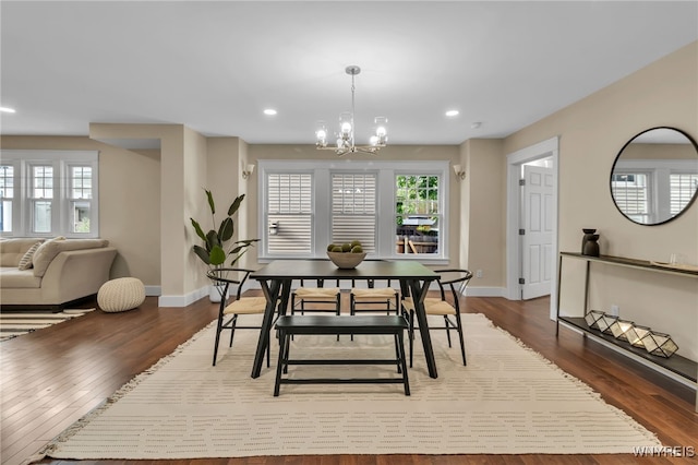 64 Sagamore Ter, Buffalo, NY 14214 - dining room featuring a chandelier, dark wood-type flooring, recessed lighting, and plenty of natural light