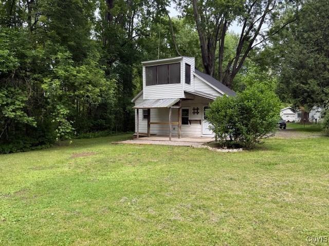 1086 Sweatman Ave, Oneida-Inside, NY 13421 - view of grassy yard featuring a sunroom