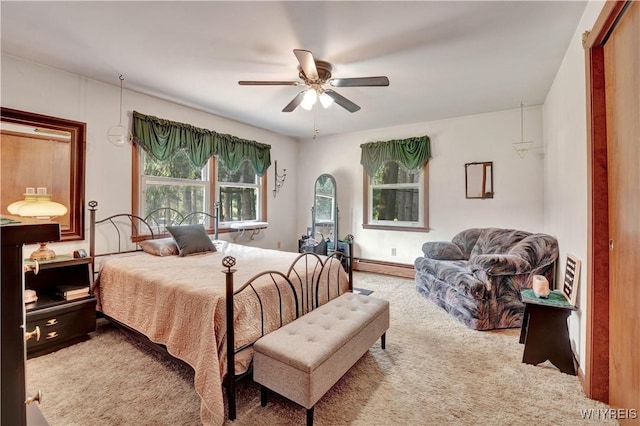 3738 Forks Rd, Yorkshire, NY 14134 - bedroom with carpet, a baseboard heating unit, and ceiling fan