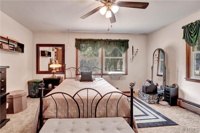 3738 Forks Rd, Yorkshire, NY 14134 - bedroom featuring carpet floors, a baseboard heating unit, and a ceiling fan