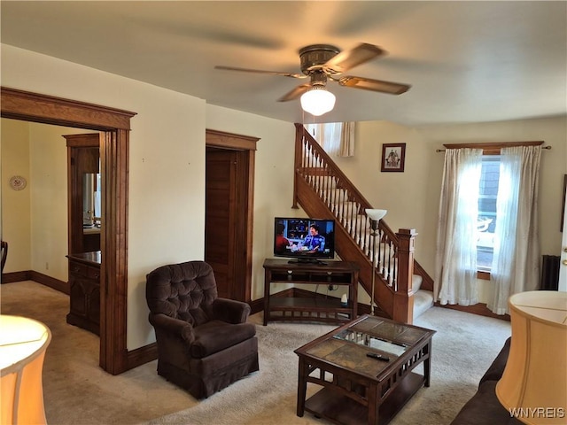 359 Utica St, Tonawanda-City, NY 14150 - carpeted living room featuring stairs and a ceiling fan