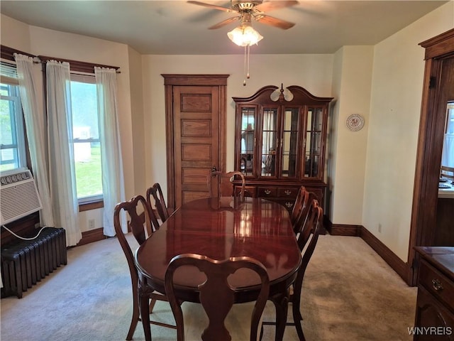 359 Utica St, Tonawanda-City, NY 14150 - dining area featuring light carpet, radiator heating unit, and ceiling fan