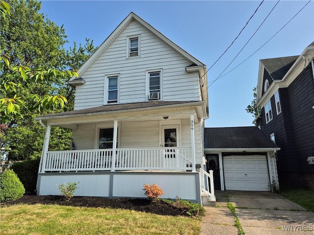 359 Utica St, Tonawanda-City, NY 14150 - view of front of property featuring a porch, a garage, concrete driveway, and cooling unit