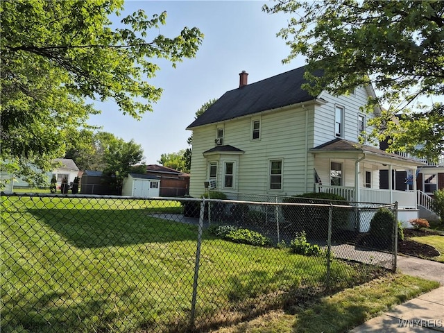 359 Utica St, Tonawanda-City, NY 14150 - view of side of home featuring a chimney, a storage shed, and a porch