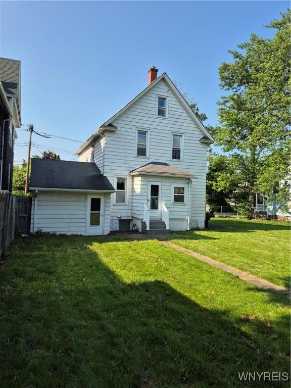 359 Utica St, Tonawanda-City, NY 14150 - back of property featuring entry steps and a chimney