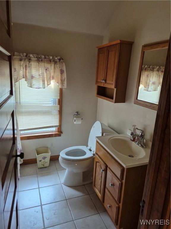 359 Utica St, Tonawanda-City, NY 14150 - half bathroom with vanity, tile patterned floors, and plenty of natural light