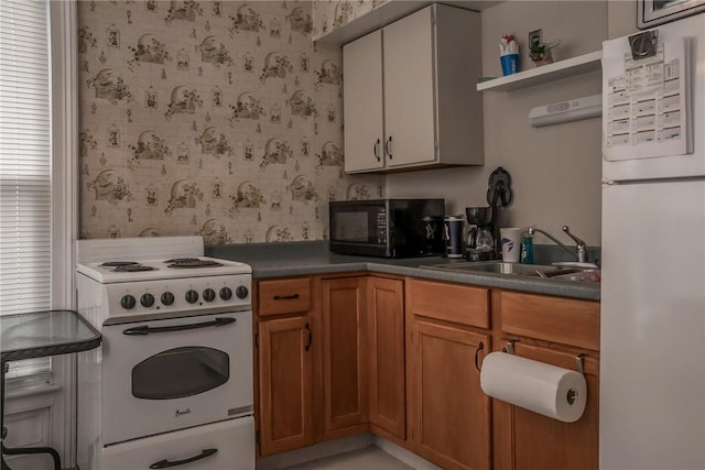 21 Washington St, Greene, NY 13778 - kitchen with white appliances, wallpapered walls, brown cabinetry, dark countertops, and open shelves
