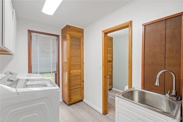 670 County Route 25th Rd Unit 25, Minetto, NY 13126 - laundry room featuring cabinet space, washer and dryer, light wood-style floors, and ornamental molding