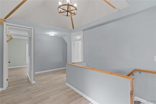 670 County Route 25th Rd Unit 25, Minetto, NY 13126 - hall with an upstairs landing, a chandelier, vaulted ceiling, and light wood finished floors