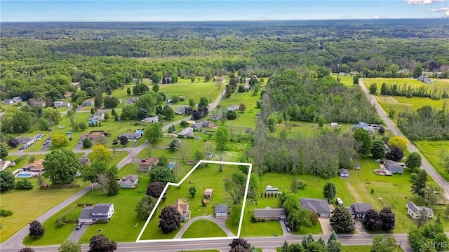 670 County Route 25th Rd Unit 25, Minetto, NY 13126 - aerial view of property and surrounding area featuring a heavily wooded area and property parcel outlined