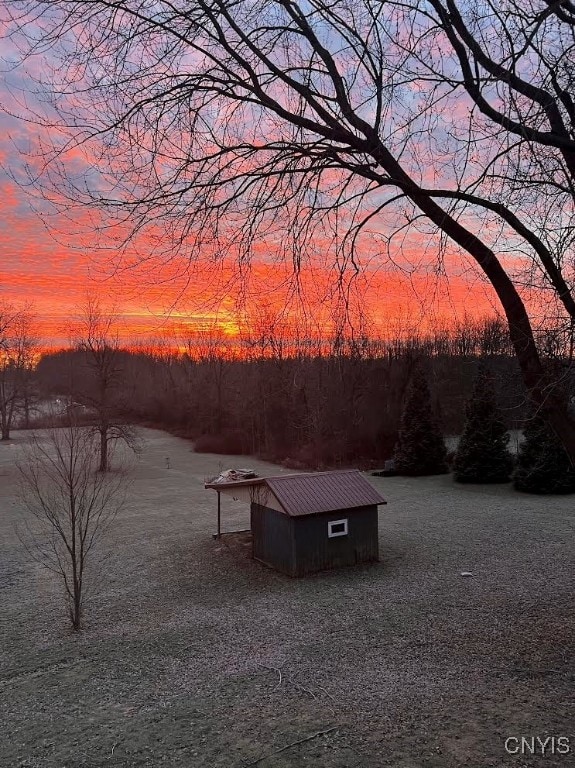 670 County Route 25th Rd Unit 25, Minetto, NY 13126 - yard at dusk with a shed
