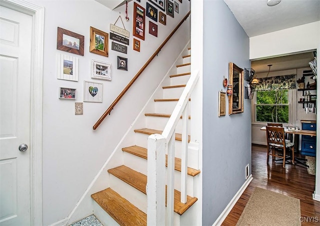 5458 Oxbow Rd, Cazenovia, NY 13035 - staircase featuring wood finished floors and baseboards