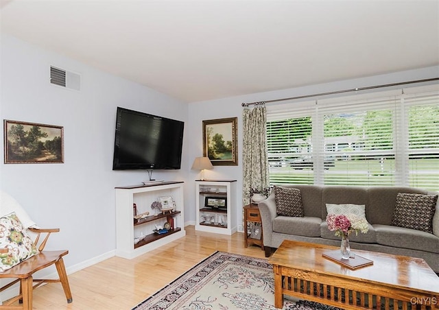 5458 Oxbow Rd, Cazenovia, NY 13035 - living area featuring light wood-type flooring and baseboards
