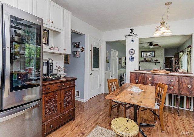 5458 Oxbow Rd, Cazenovia, NY 13035 - dining space with light wood-type flooring and ceiling fan