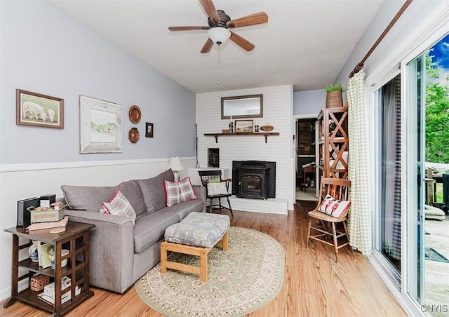 5458 Oxbow Rd, Cazenovia, NY 13035 - living area featuring wood finished floors, a ceiling fan, and wainscoting
