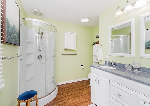 5458 Oxbow Rd, Cazenovia, NY 13035 - bathroom featuring a shower stall, wood finished floors, and vanity