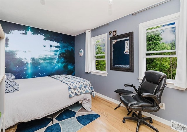 5458 Oxbow Rd, Cazenovia, NY 13035 - bedroom featuring wood finished floors and an office area