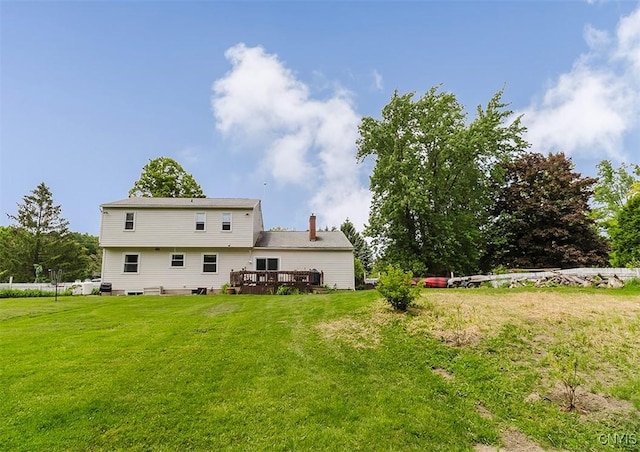 5458 Oxbow Rd, Cazenovia, NY 13035 - back of property with a deck, a lawn, and a chimney
