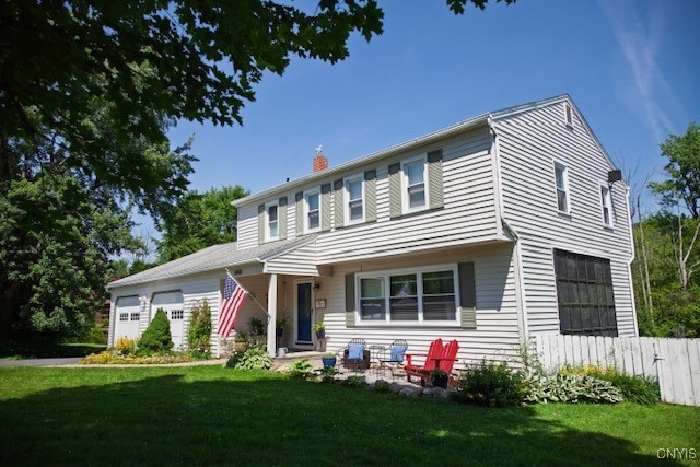 5458 Oxbow Rd, Cazenovia, NY 13035 - view of front facade with a chimney and a garage