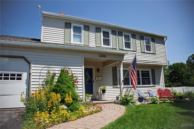 5458 Oxbow Rd, Cazenovia, NY 13035 - view of front facade featuring a garage and a porch