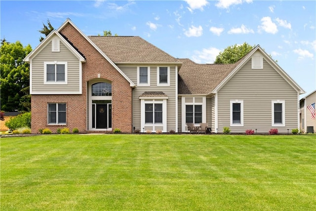 1335 Sagebrook Way, Webster, NY 14580 - traditional-style house featuring a front yard, brick siding, and a shingled roof