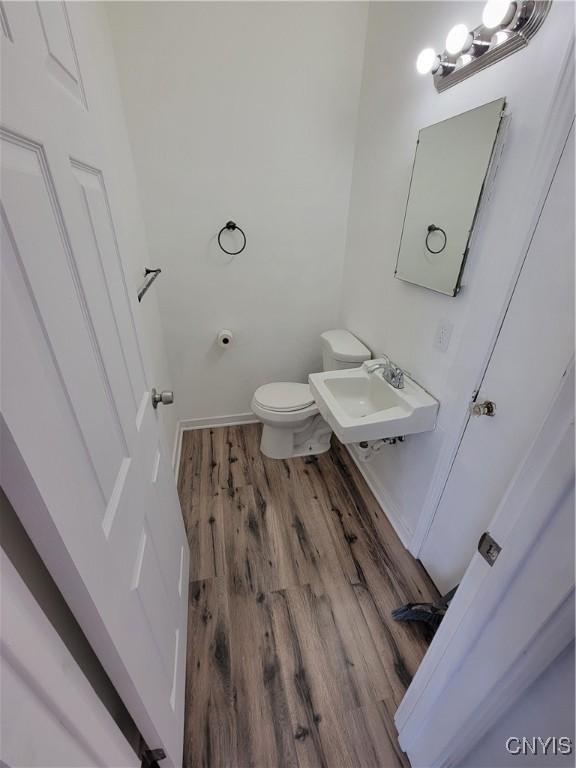 1665 State Route 31, Sullivan, NY 13037 - half bathroom with a sink and wood finished floors