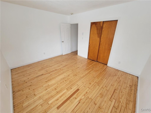 1665 State Route 31, Sullivan, NY 13037 - unfurnished bedroom featuring light wood-style floors and a closet