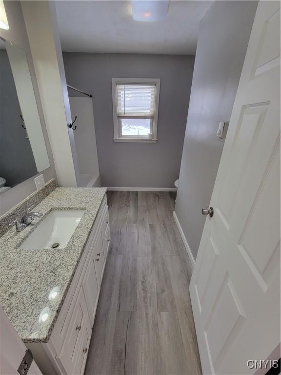 1665 State Route 31, Sullivan, NY 13037 - full bathroom with wood finished floors, vanity, and a shower