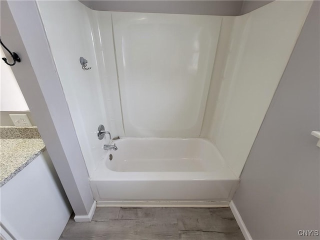 1665 State Route 31, Sullivan, NY 13037 - bathroom featuring shower / washtub combination, wood finished floors, and vanity