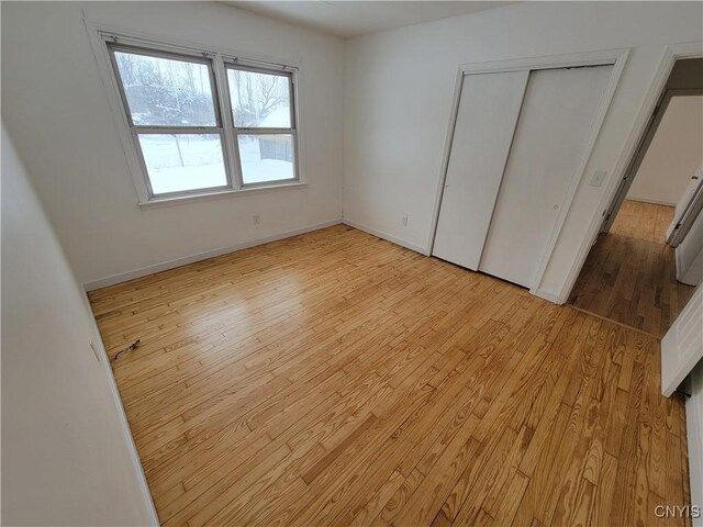 1665 State Route 31, Sullivan, NY 13037 - unfurnished bedroom featuring light wood finished floors and a closet
