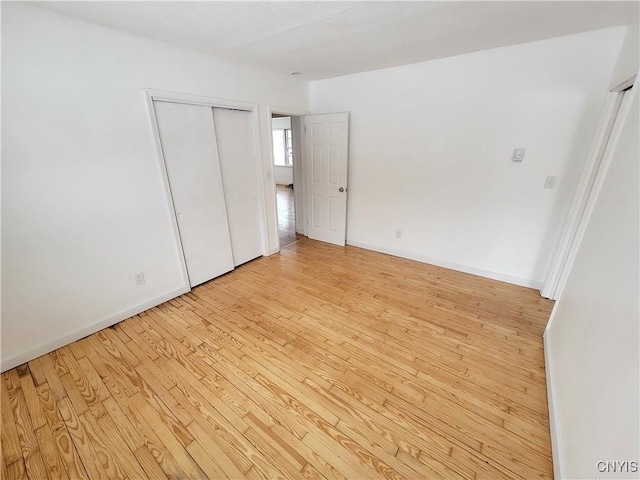 1665 State Route 31, Sullivan, NY 13037 - unfurnished bedroom with light wood-style flooring and a closet