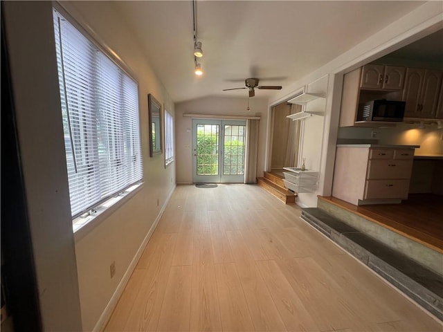 119 Platt St, Erwin, NY 14870 - unfurnished living room featuring a ceiling fan, light wood-type flooring, vaulted ceiling, and track lighting