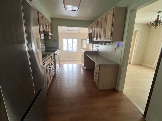 119 Platt St, Erwin, NY 14870 - kitchen featuring freestanding refrigerator, wood finished floors, under cabinet range hood, a chandelier, and dishwashing machine