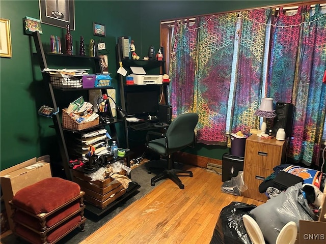 522 Craig St, Syracuse, NY 13208 - office area featuring wood finished floors and a baseboard heating unit