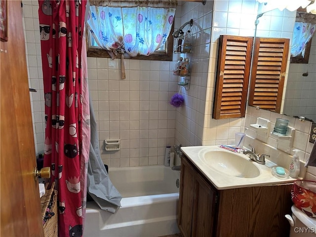 522 Craig St, Syracuse, NY 13208 - bathroom featuring vanity, shower / bath combination with curtain, tasteful backsplash, and tile walls