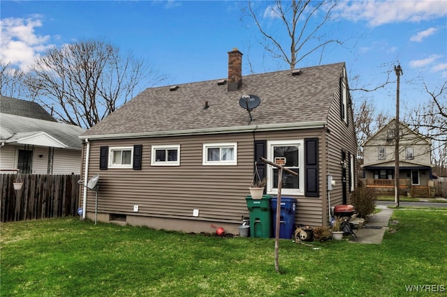 2125 Seneca Ave, Niagara Falls, NY 14305 - back of house featuring a chimney and roof with shingles